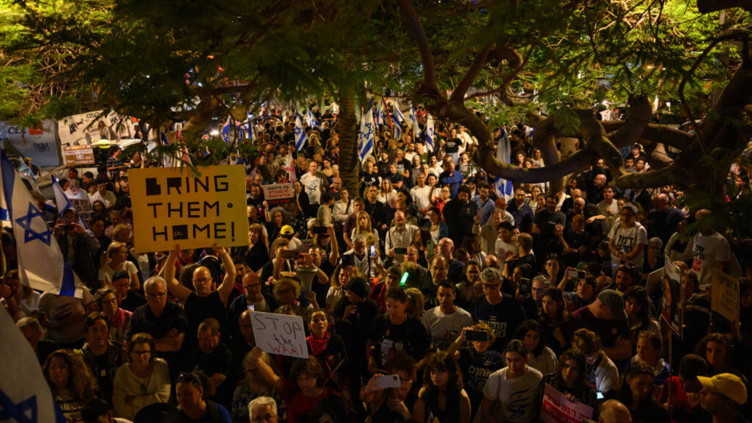 Protesters hear the Declaration of Independence being recited in Tel Aviv after a march calling for Prime Minister Benjamin Netanyahu's resignation. (Photo by Alexi J. Rosenfeld/Getty Images)
