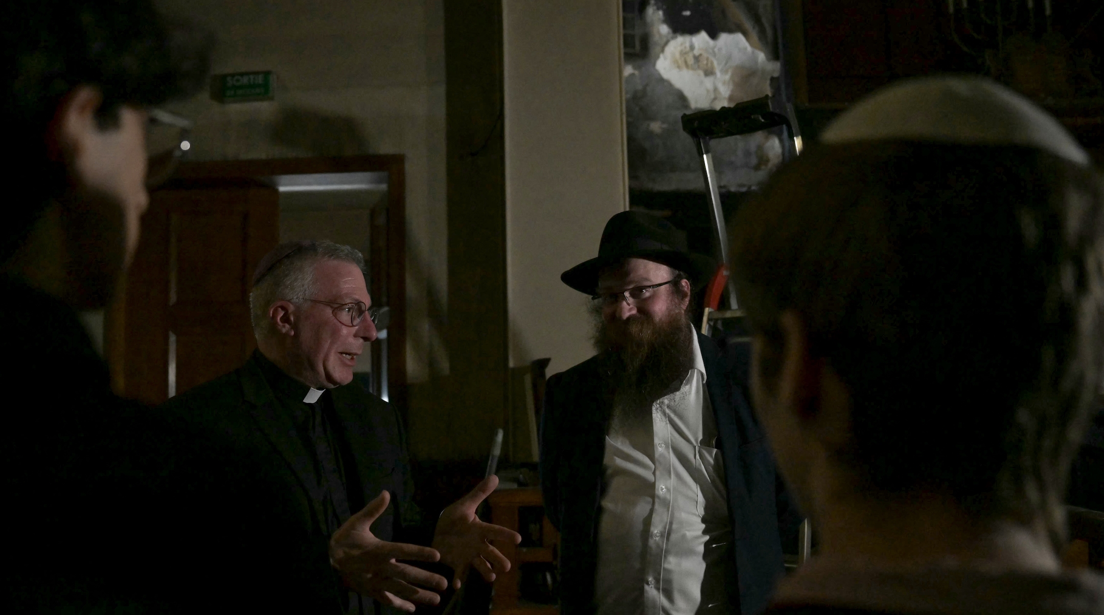 The rabbi of the synagogue in Rouen, France, takes visitors on a tour after an arson attack in which the arsonist was shot dead by police, May 17, 2024. (Lou Benoist / AFP via Getty Images)