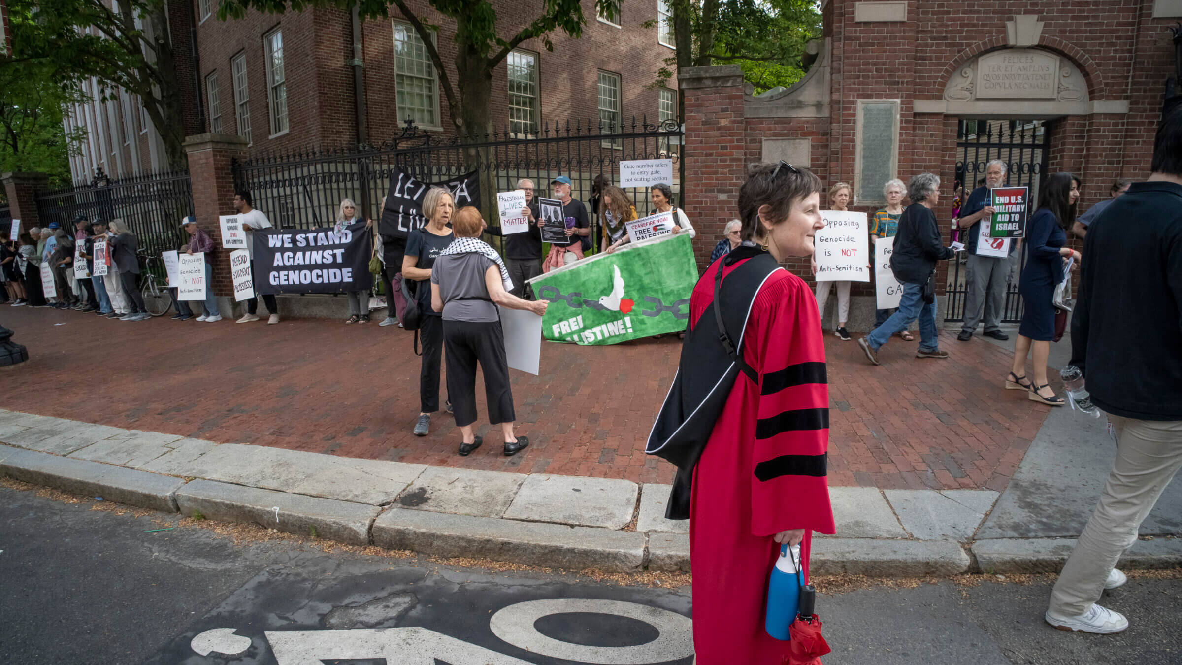 Pro-Palestinian demonstrators protest outside Harvard Yard during the university's 2024 graduation on Thursday 