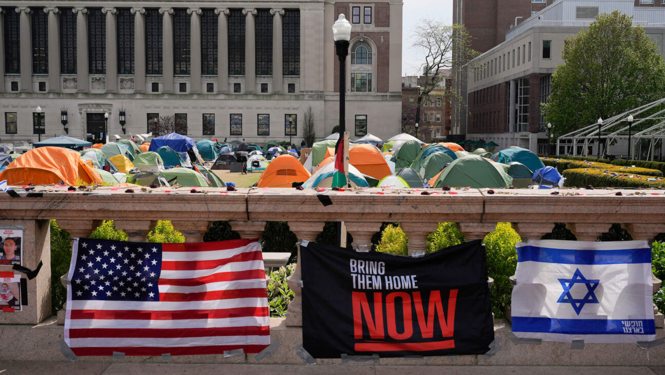 An Israeli flag, American flag, and sign reading "Bring them home now" placed next to the encampment of pro-Palestinian student protesters at Columbia University on April 30.  