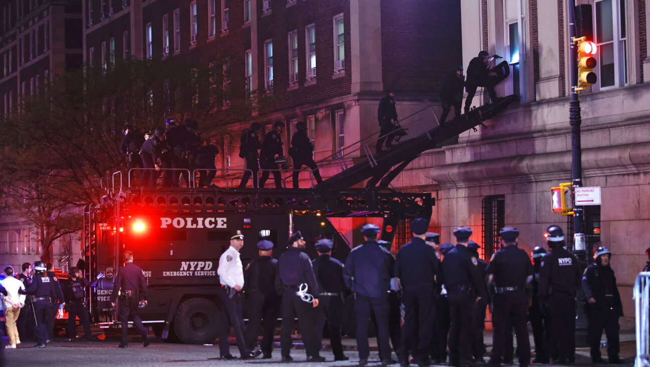 NYPD officers in riot gear break into Hamilton Hall at Columbia University, where pro-Palestinian students  barricaded themselves inside a building, April 30, 2024. 