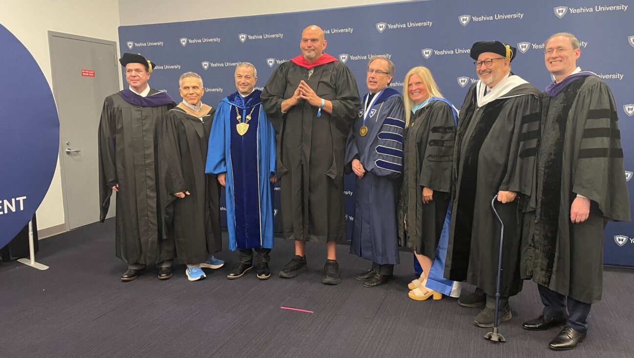 Sen. Jon Fetterman, center, with Yeshiva University leadership, ahead of the university’s commencement ceremony in Queens, May 29, 2024. (Luke Tress)