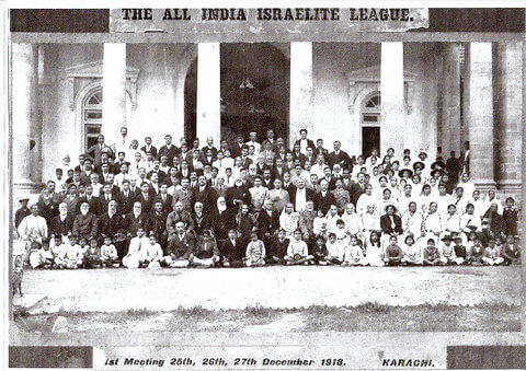 A black and white photo with the words "All India Israelite League" on top and "1st Meeting 25th, 26th, 27th December 1918" on the bottom.