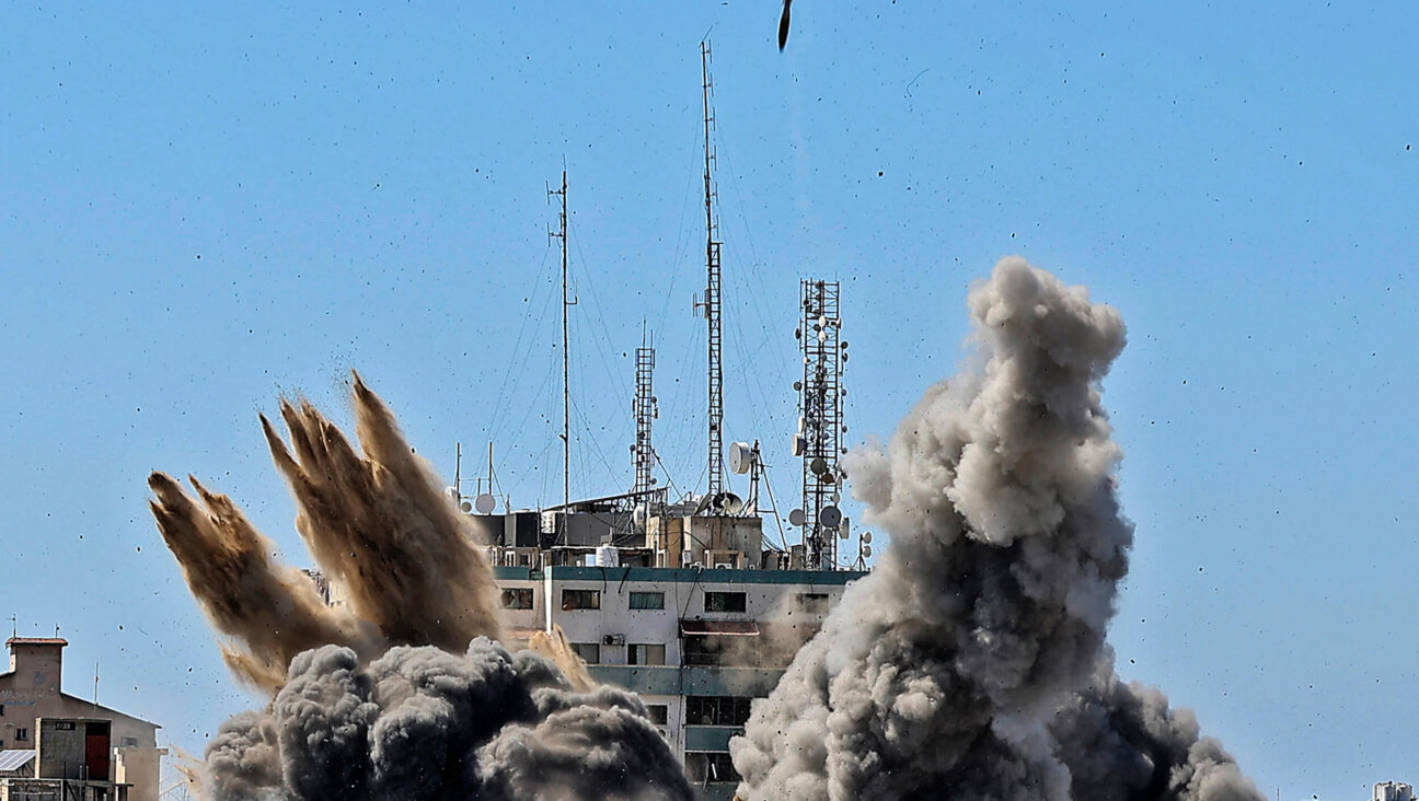 Smoke billows amid an Israeli airstrike on the Jala Tower, which housed  Associated Press offices in Gaza, in 2021.