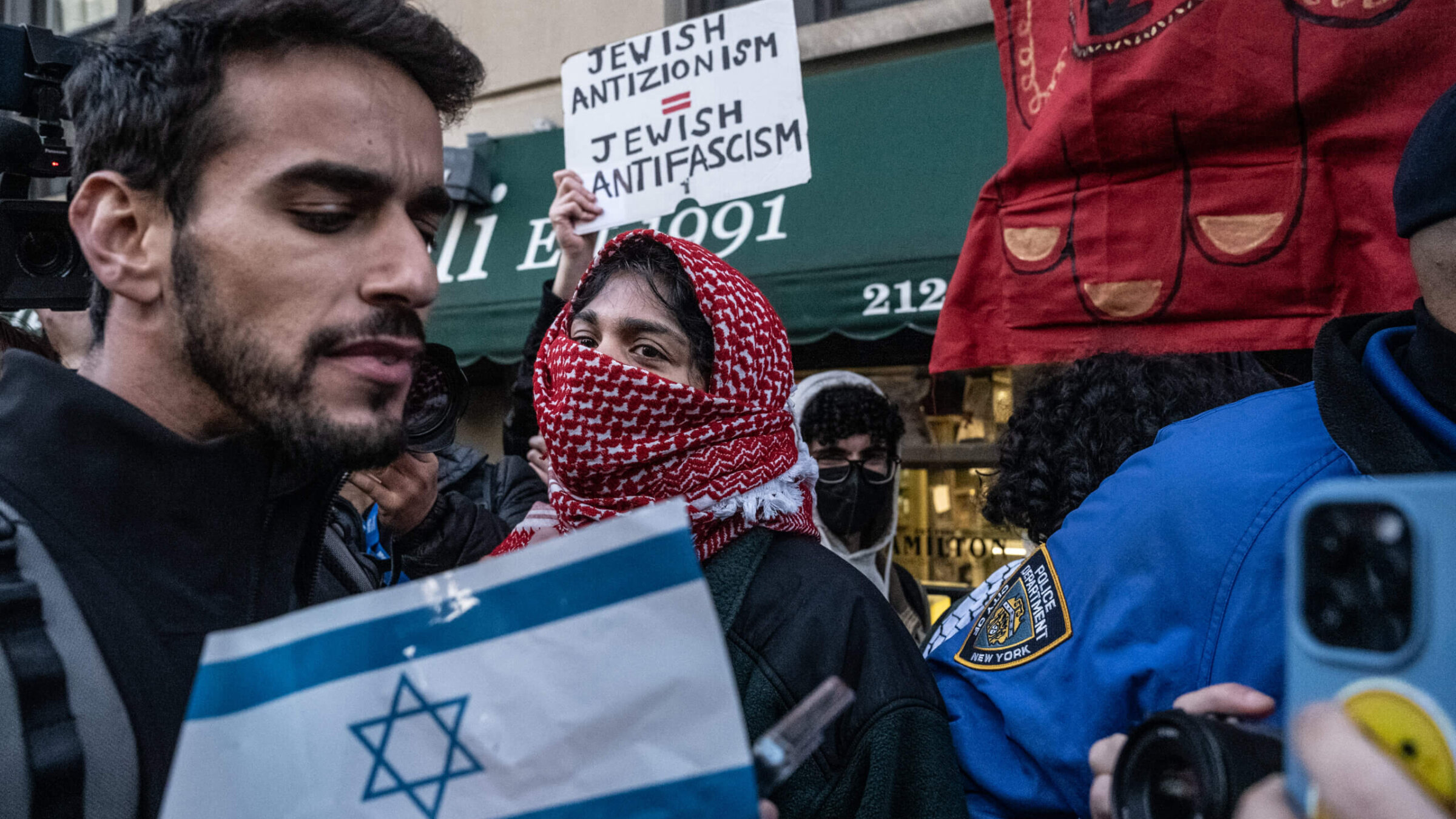 Israel supporters clash with pro-Palestinian protesters as they participate in the United for Israel march outside of Columbia University on April 25, 2024.
