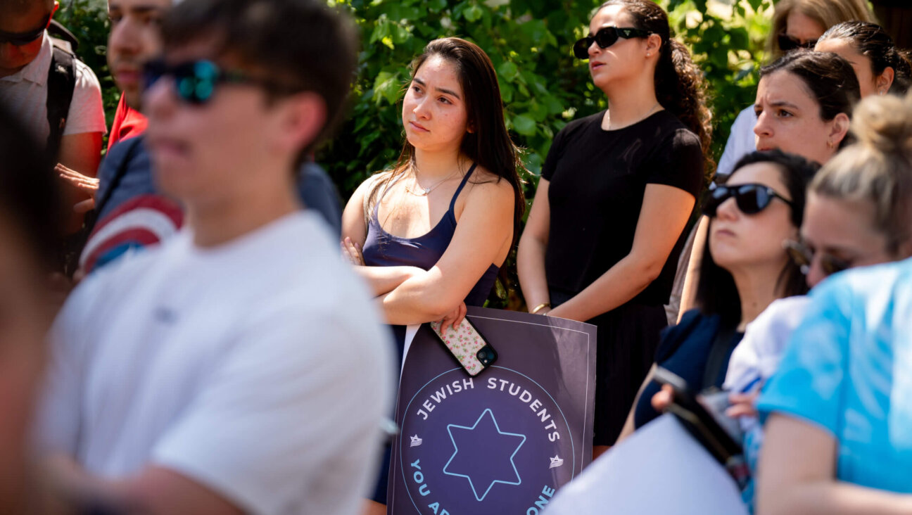 A woman holds a sign that reads "Jewish Students You Are Not Alone" during a rally against campus antisemitism at George Washington University on May 2, 2024 in Washington, DC. 