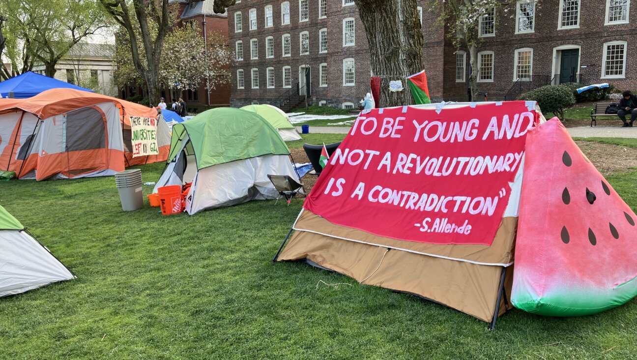 A sign at Brown's encampment highlights students' idealism.