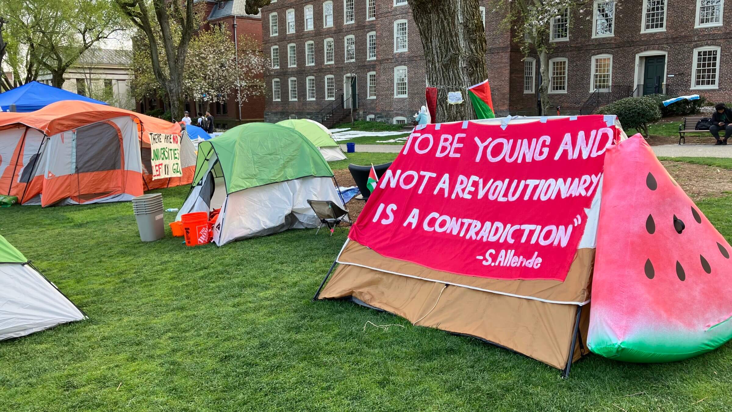 A sign at Brown's encampment highlights students' idealism.