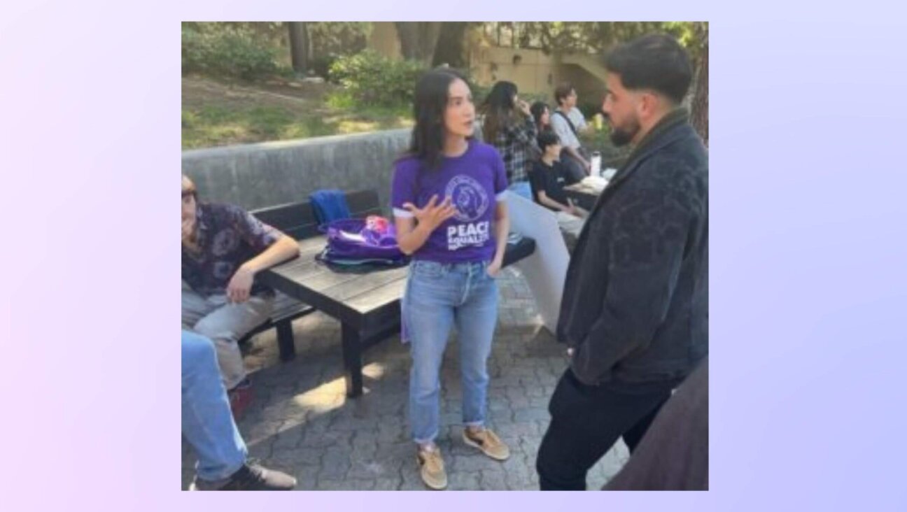 Zahra Sakkejha, a Palestinian-Canadian member of LA Standing Together, speaks with Rudy Rochman, an Israeli-American activist, at UCLA.