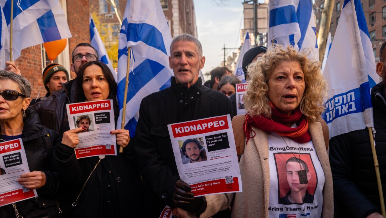 Left wing Israeli leader Yair Golan alongside protesters outside the home of U.N. Secretary-General Antonio Guterres, December 8, 2024. (Luke Tress)