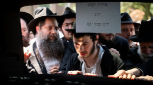 The funeral procession of Rabbi Moshe Kotlarsky in Crown Heights, Brooklyn, June 5, 2024. (Luke Tress)