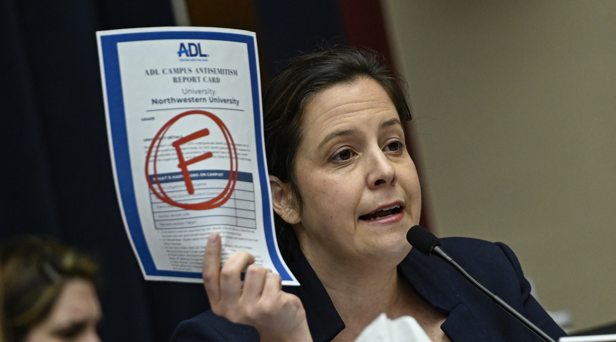 New York Republican U.S. Rep. Elise Stefanik displays the Anti-Defamation League’s “F” campus report card grade for Northwestern as the presidents of that school, Rutgers, and UCLA testify before the committee in the Rayburn House Office Building on Capitol Hill in Washington DC, United States on May 23, 2024. (Celal Gunes/Anadolu via Getty Images)