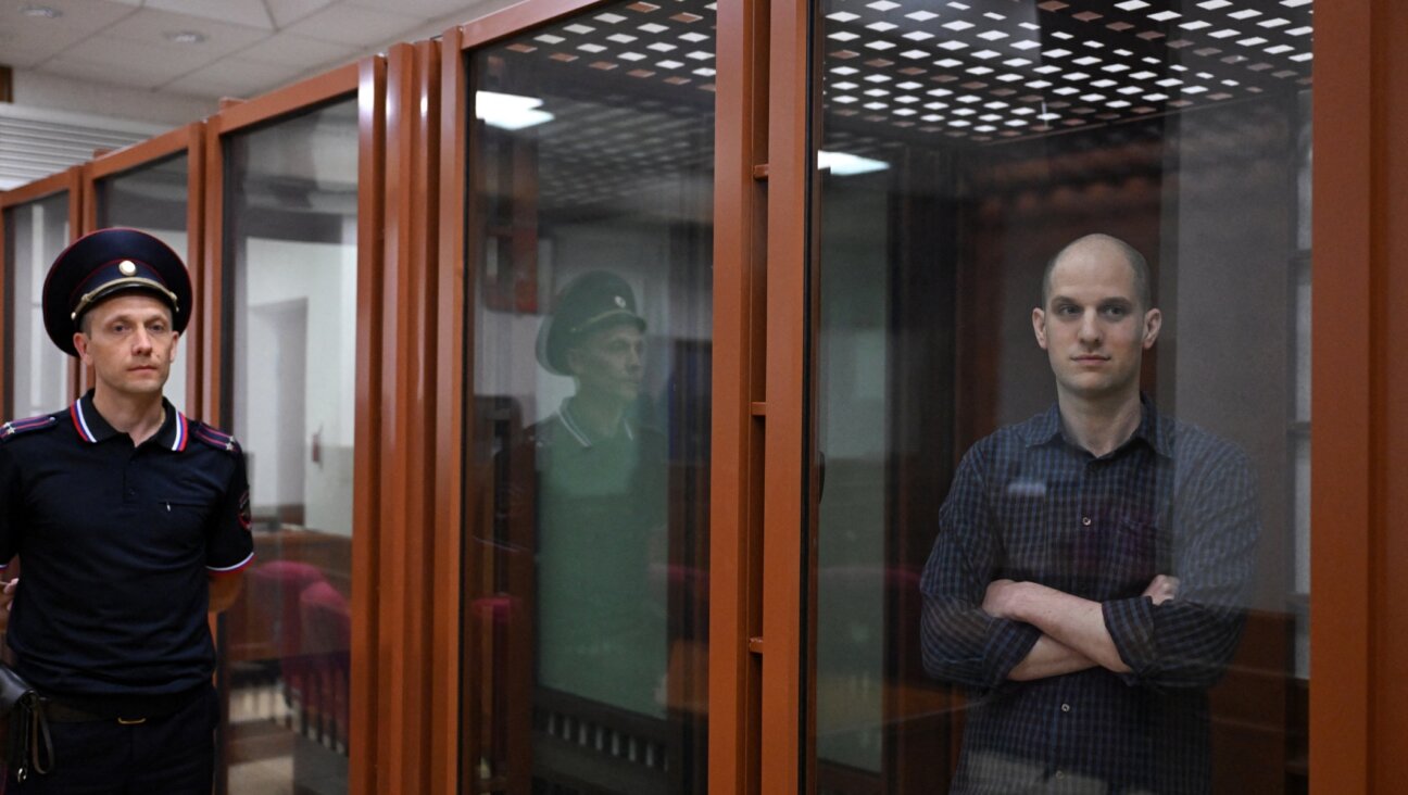 Wall Street Journal reporter Evan Gershkovich stands in the glass defendants’ cage in the Yekaterinburg courthouse where his trial began Wed. June 26. (Natalia Kolesnikova/AFP via Getty Images)