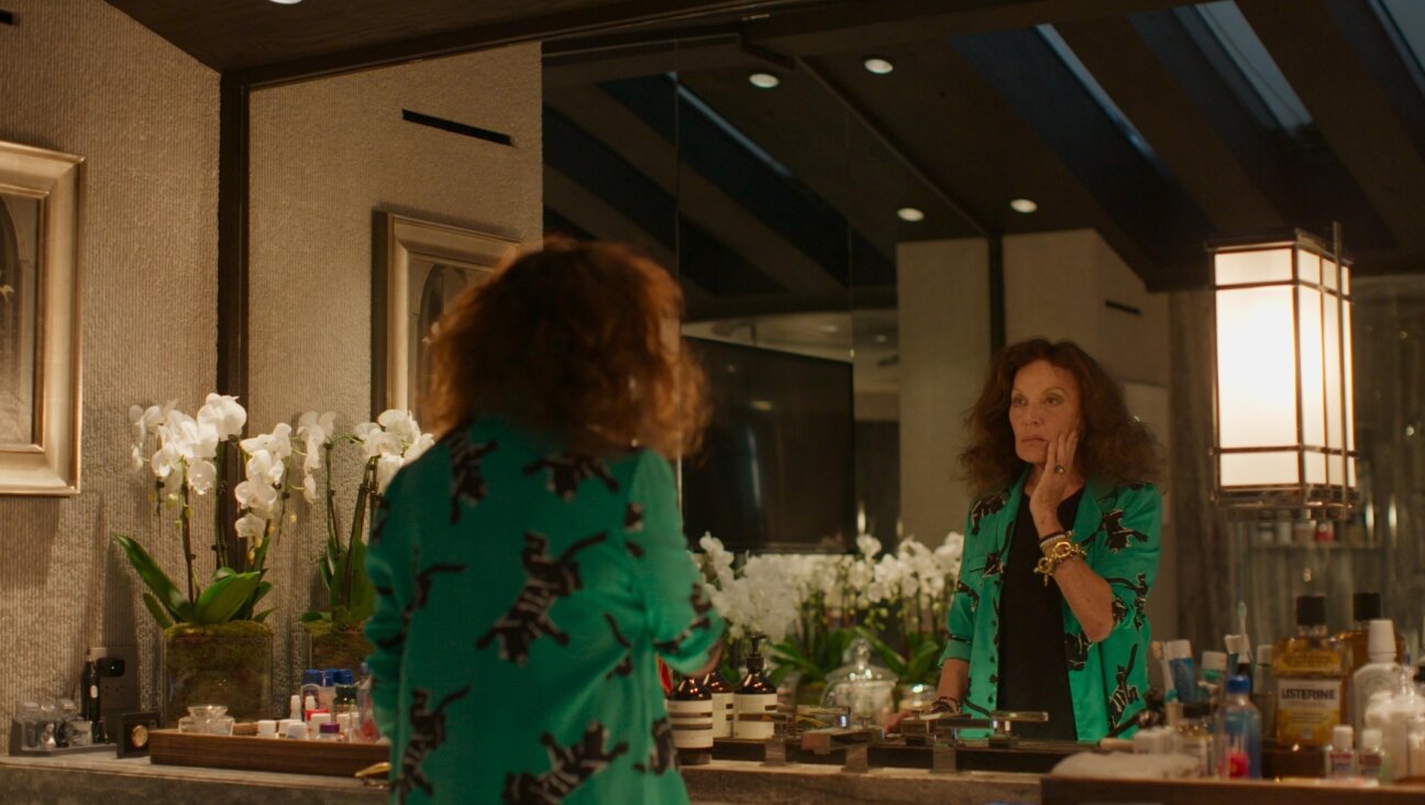 Diane von Furstenberg looks at herself in the mirror. (Courtesy Hulu)
