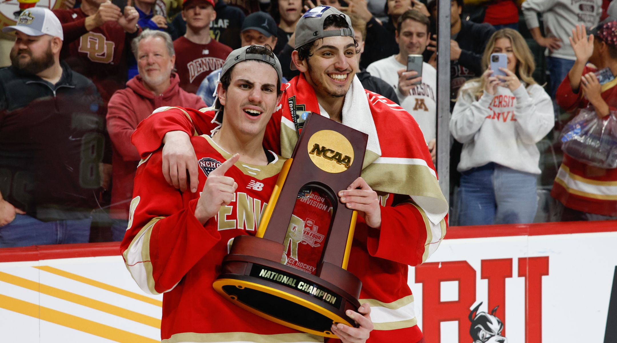 Zeev Buium, left, and his brother Shai celebrate after winning the NCAA Division I men’s hockey championship with the University of Denver, April 13, 2024. (Richard T Gagnon/Getty Images)