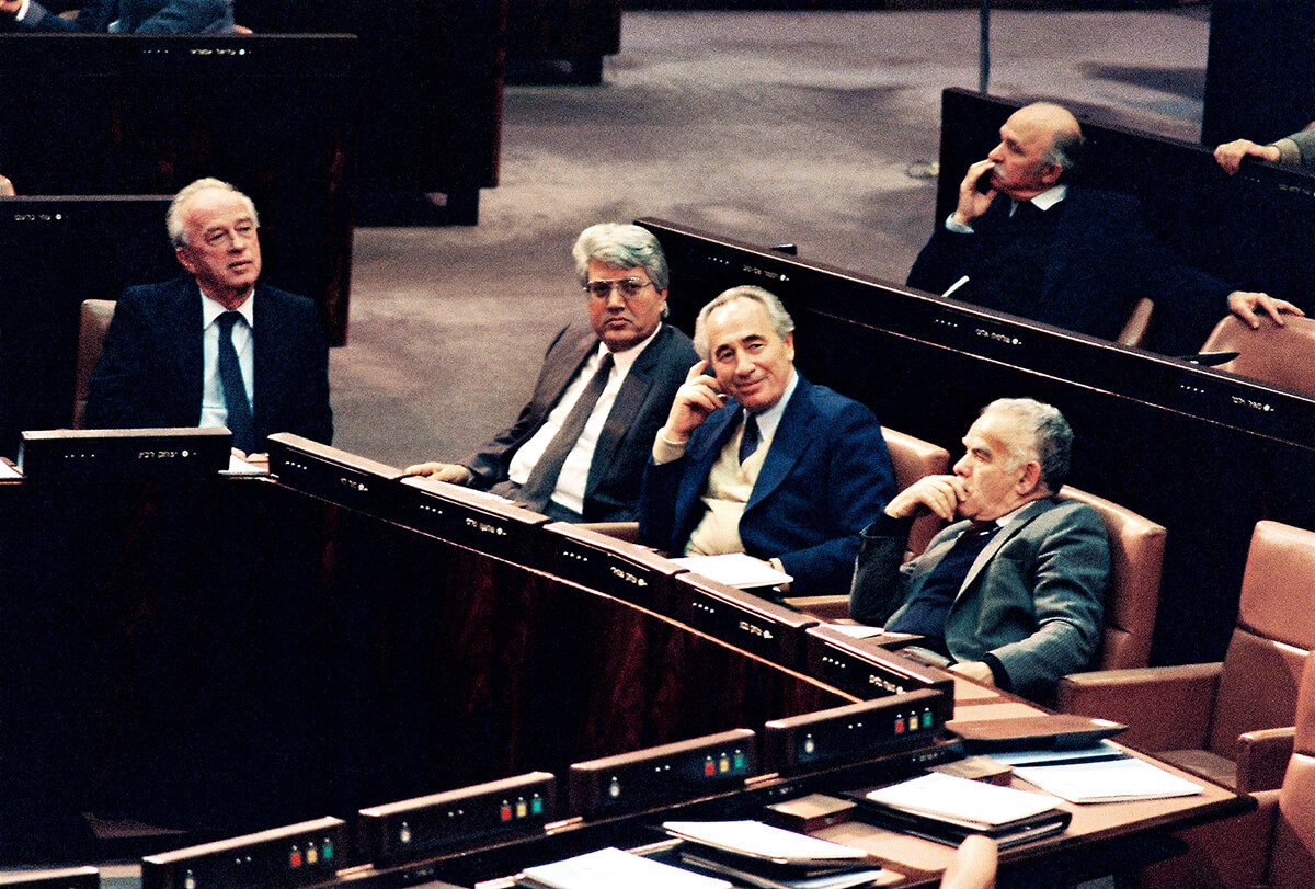 David Levy, second from left, with (from left) Yitzhak Rabin, Shimon Peres and Yitzhak Shamir in the Knesset in 1988.