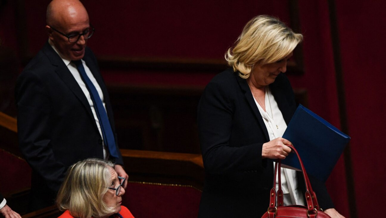 President of the French conservative party Les Republicains and member of Parliament Eric Ciotti and far-right National Rally president Marine Le Pen attend a session of the National Assembly in Paris, April 4, 2023. Ciotti announced in June 2024 that he would consider allying with Le Pen, shattering French political norms. (Christophe Archambault / AFP via Getty Images)