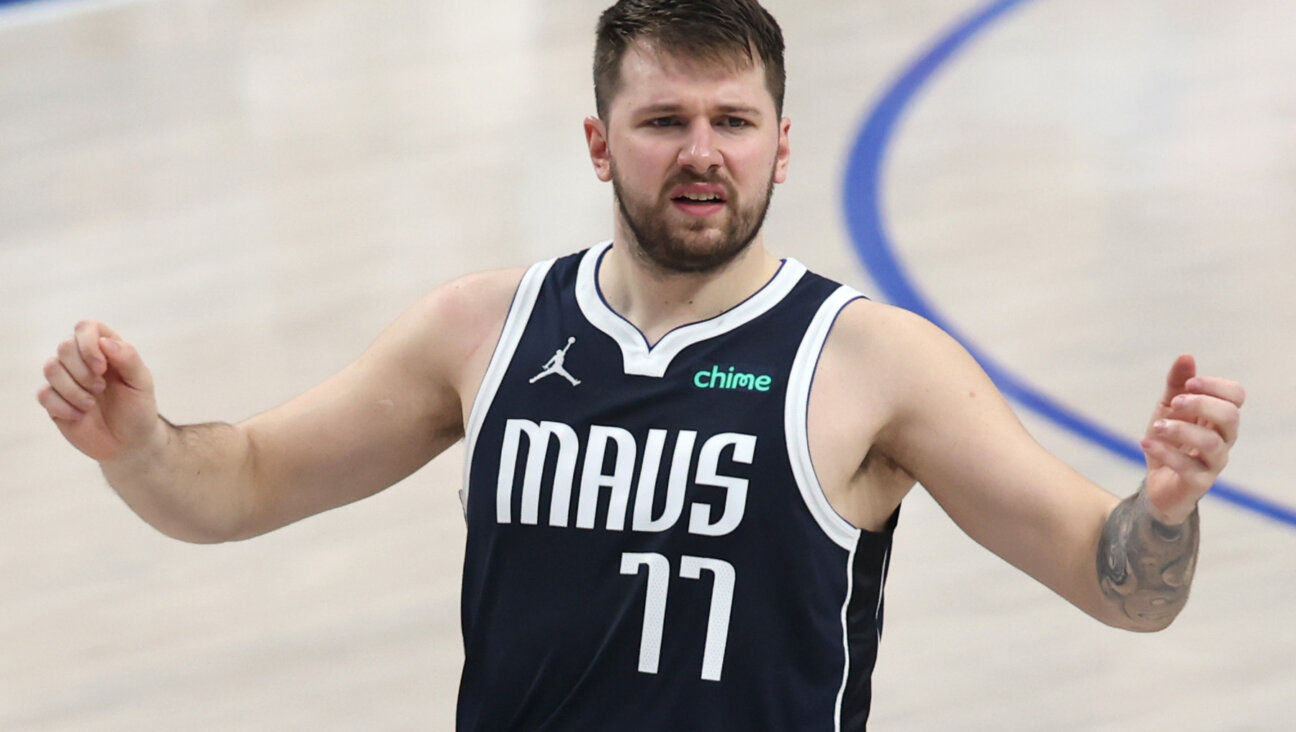 DALLAS, TEXAS - MAY 28:  Luka Doncic #77 of the Dallas Mavericks reacts during the second quarter against the Minnesota Timberwolves in Game Four of the Western Conference Finals at American Airlines Center on May 28, 2024 in Dallas, Texas. 