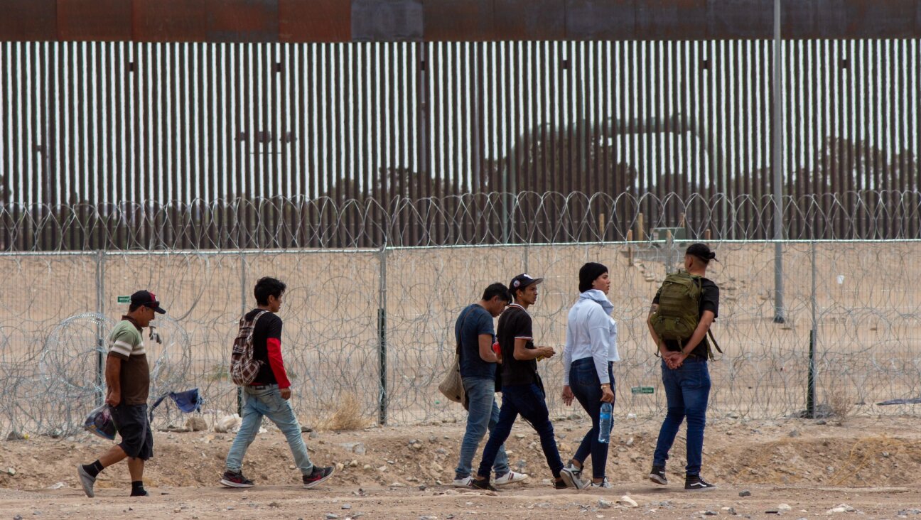 Migrants at the U.S.-Mexico border on the day President Joe Biden signed a new executive order restricting entry for asylum seekers, June 4, 2024, in Ciudad Juarez, Mexico. (David Peinado/Anadolu via Getty Images)