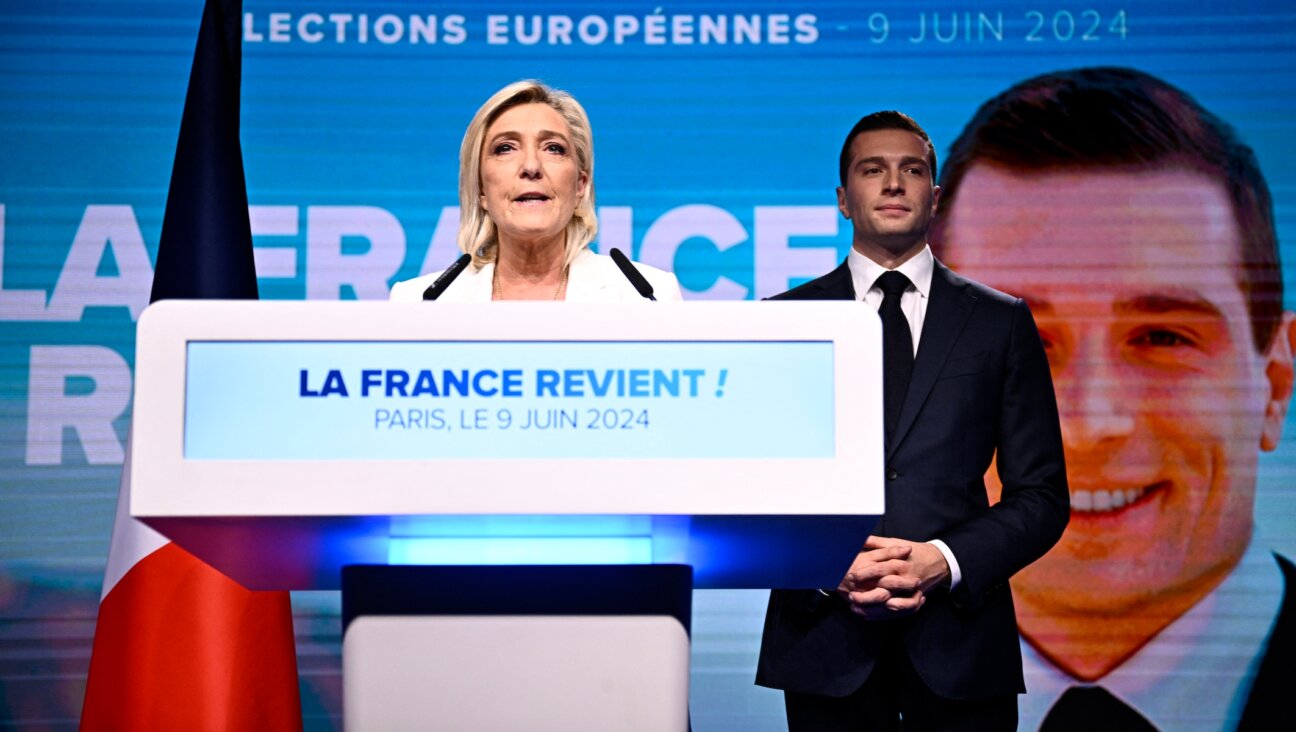 French far-right National Rally party leader Marine Le Pen (left) speaks as party President Jordan Bardella stands to her side in Paris, on June 9, 2024. (Julien De Rosa/AFP)
