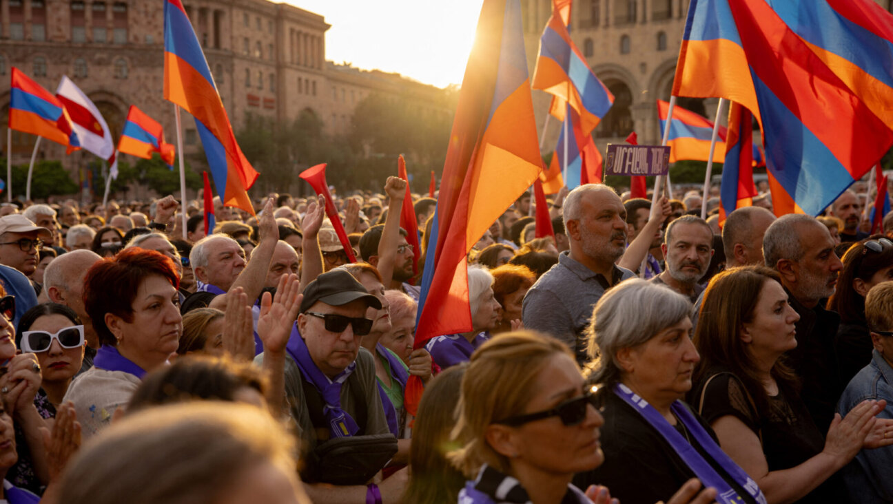 Thousands of Armenian protesters gather for Archbishop Bagrat Galstanyan’s speech during a rally against the government, in Yerevan Republic Square on June 9, 2024. (Anthony Pizzoferrato / Middle East Images / Middle East Images via AFP)