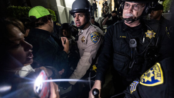 University of California Police and California Highway Patrol officers face pro-Palestinian protesters outside Dodd Hall at UCLA on June 10. Several protesters were arrested.