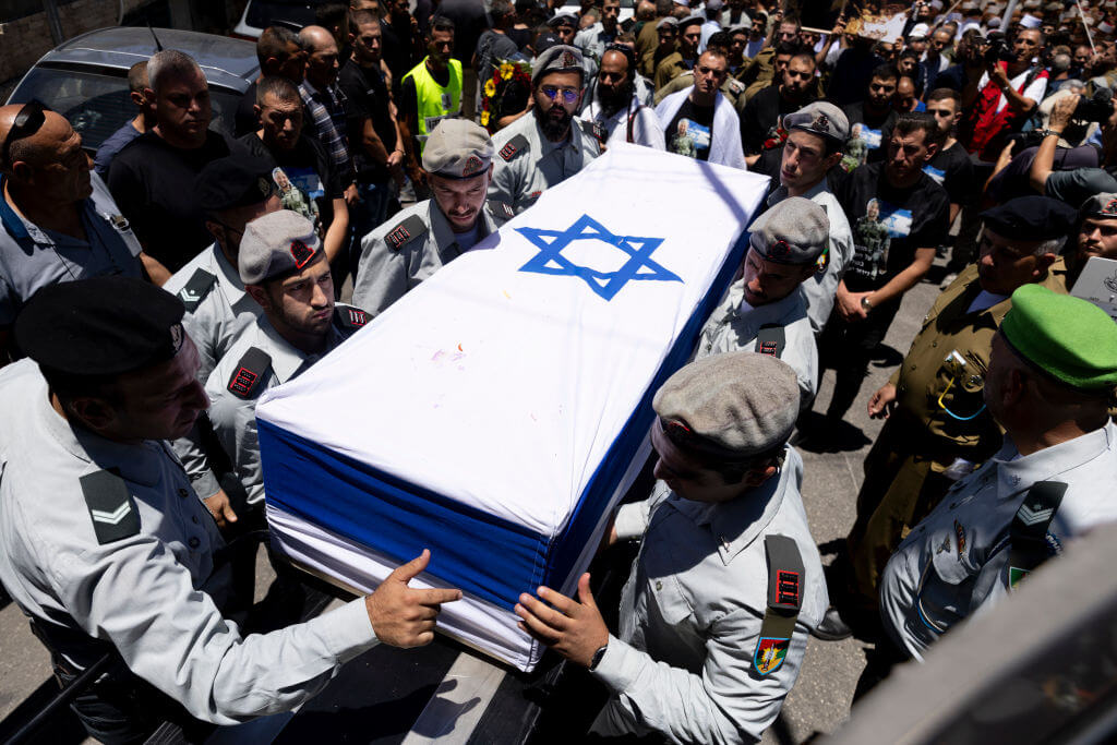 Soldiers carry the coffin of Captain Wassim Mahmoud killed in a battle in Gaza during his funeral on June 16.