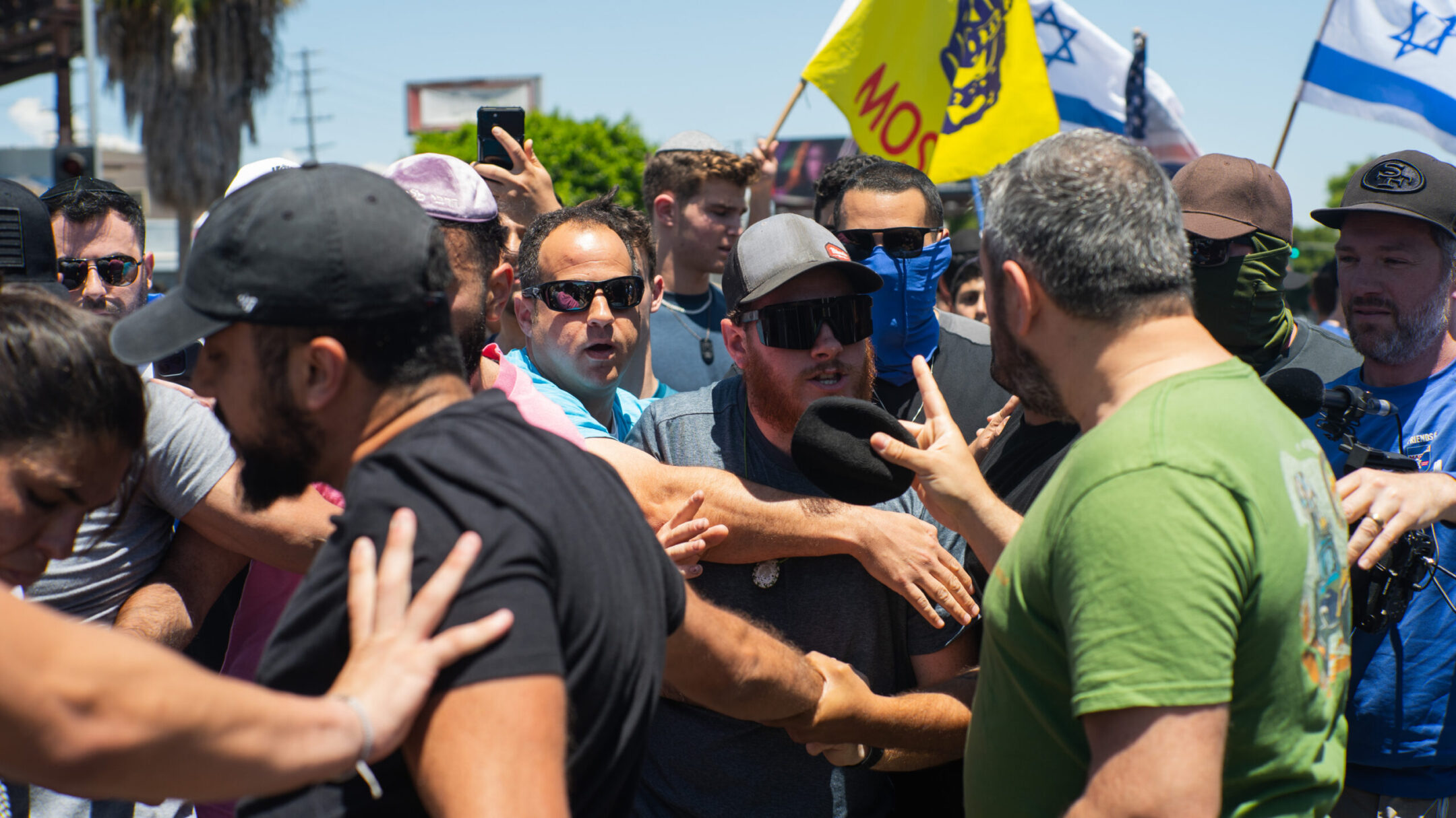 Pro-Palestinian and pro-Israel protesters clash outside a synagogue in Los Angeles June 23.
