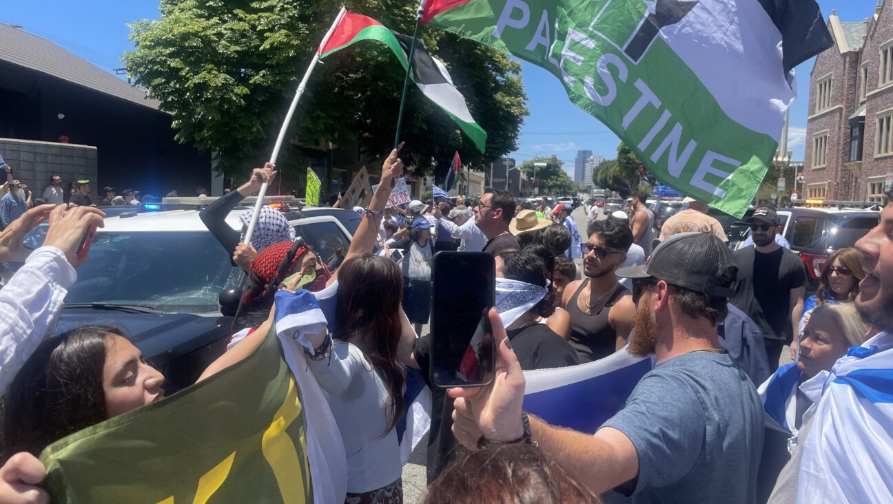 Protesters confront each other near Adas Israel synagogue in Los Angeles. Palestinian Youth Movement organized the protest in response to an event promoting the sale of Israeli real estate to American Jews.