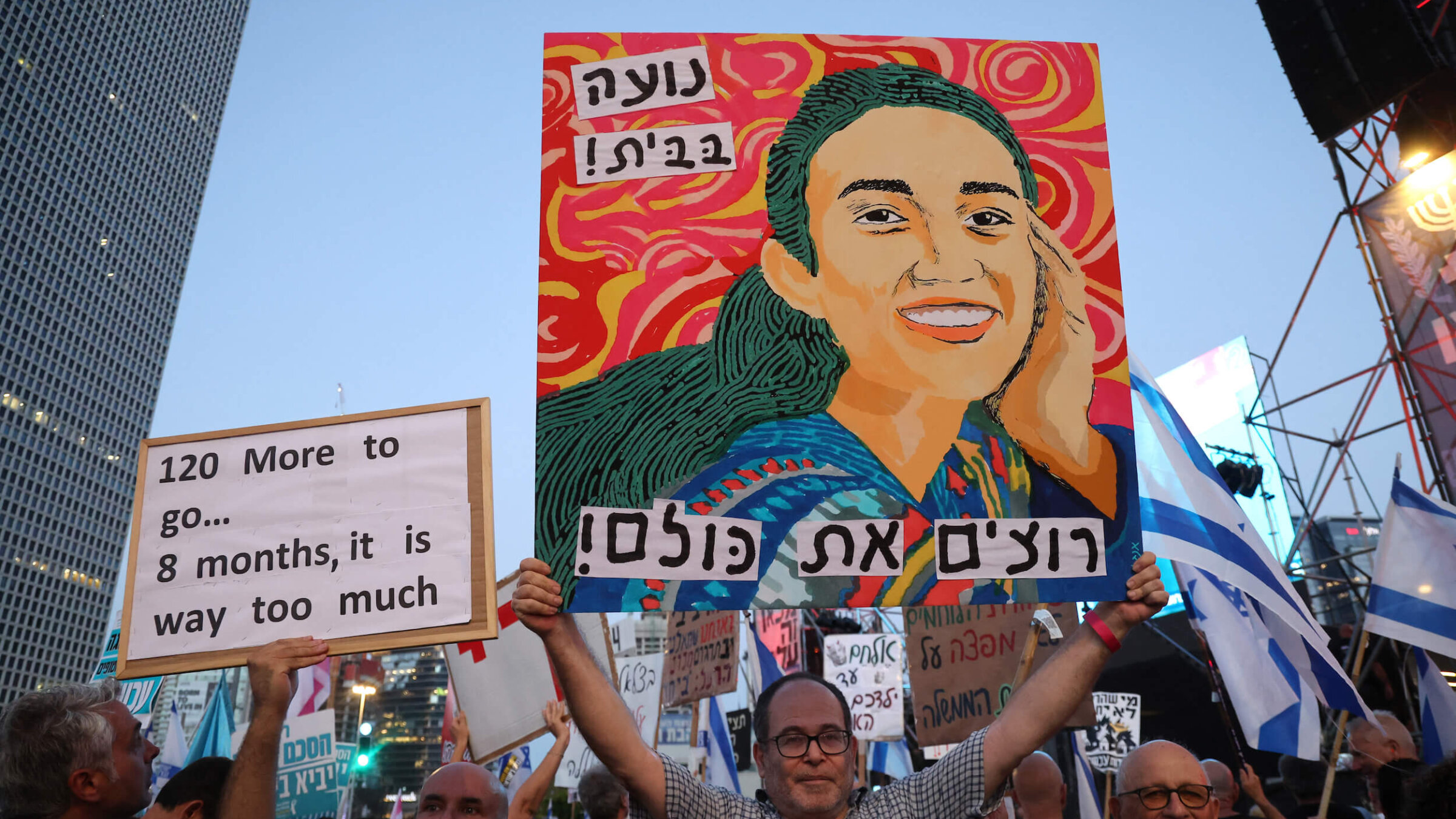 A poster depicting Noa Argamani, one of four Israeli hostages rescued by the Israeli army, was held up as Israeli activists rallied on Saturday. 
