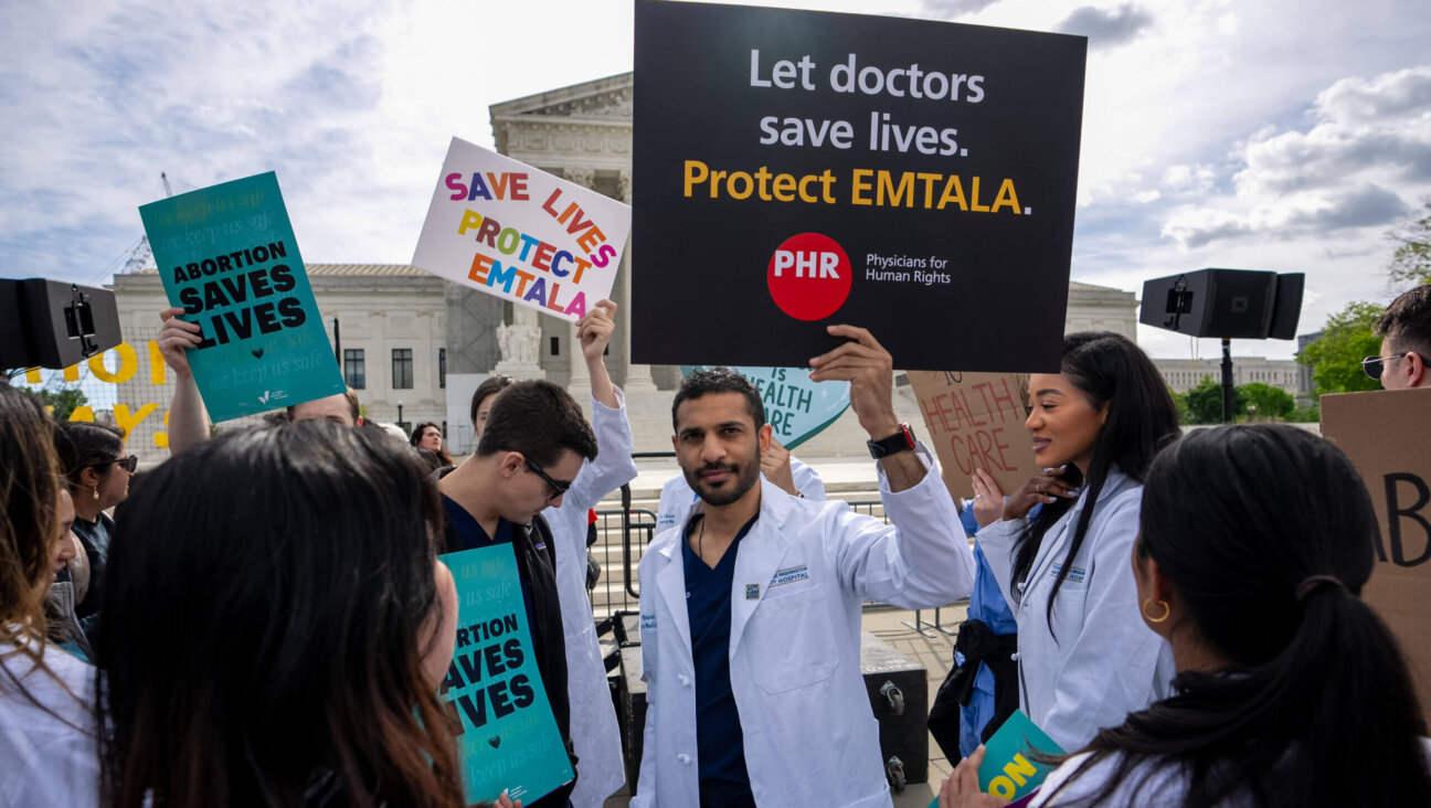A group of doctors join abortion rights supporters at a rally outside the Supreme Court. The Court heard oral arguments on a case to decide if Idaho emergency rooms can provide abortions to women in a pregnancy emergency, April 24, 2024 in Washington, DC. 