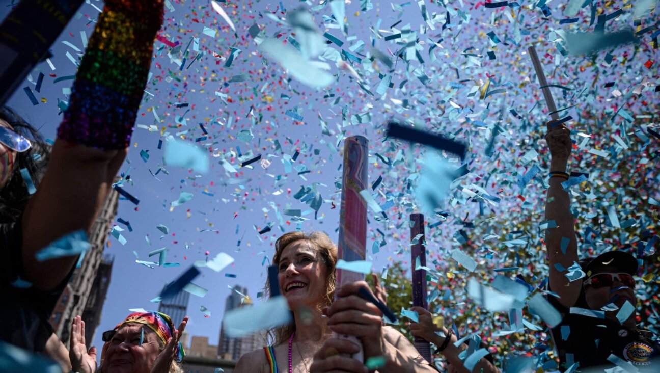 Confetti flies as participants march during the 2022 New York Pride Parade.