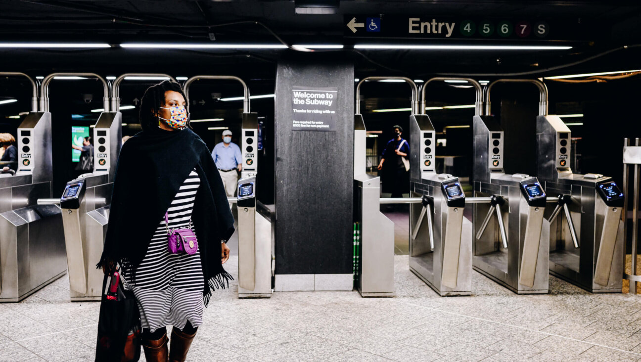 People wearing protective masks exit the subway station at Grand Central in New York, U.S., on Monday, June 14, 2021. 