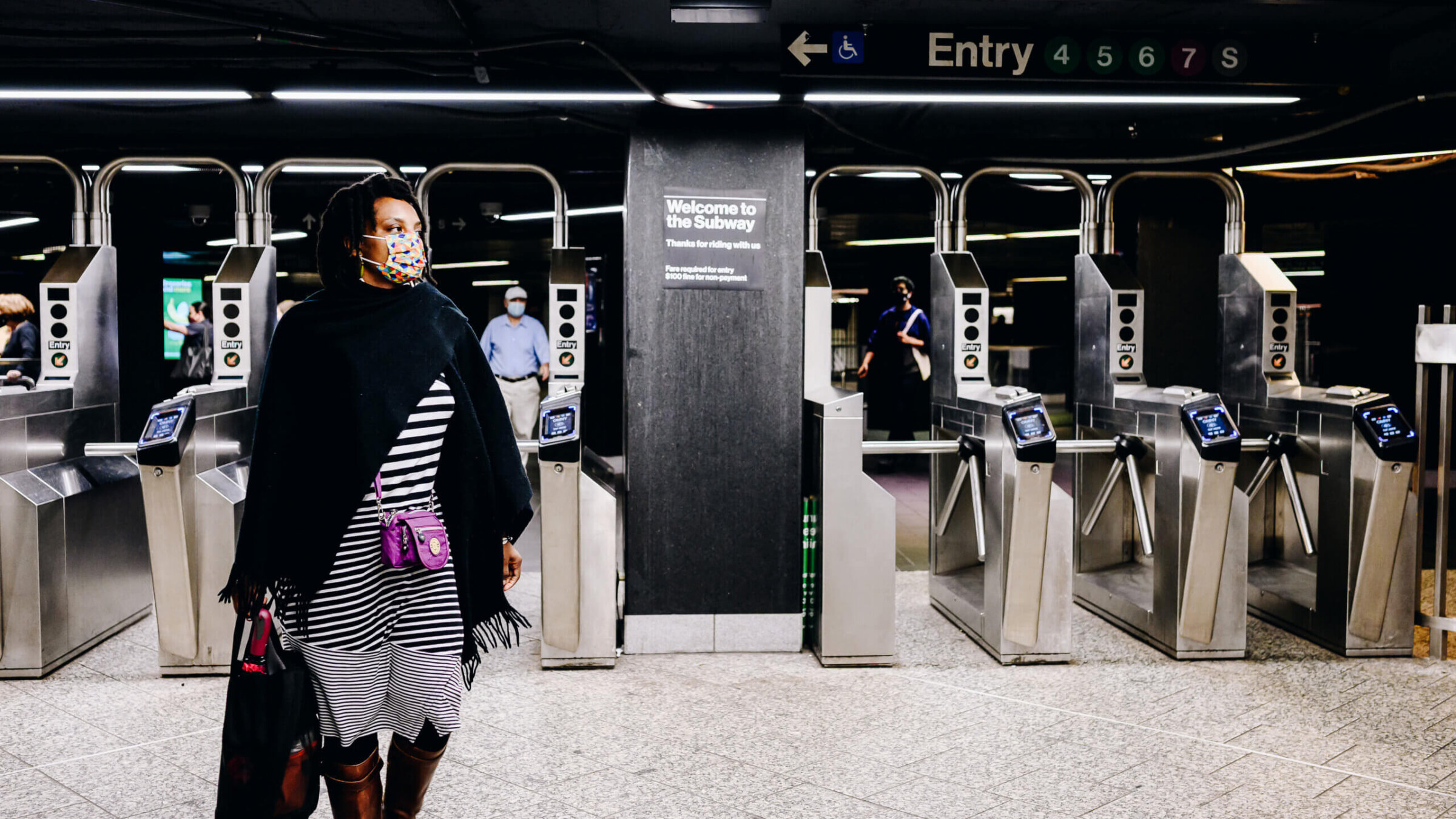 People wearing protective masks exit the subway station at Grand Central in New York City June 14, 2021.