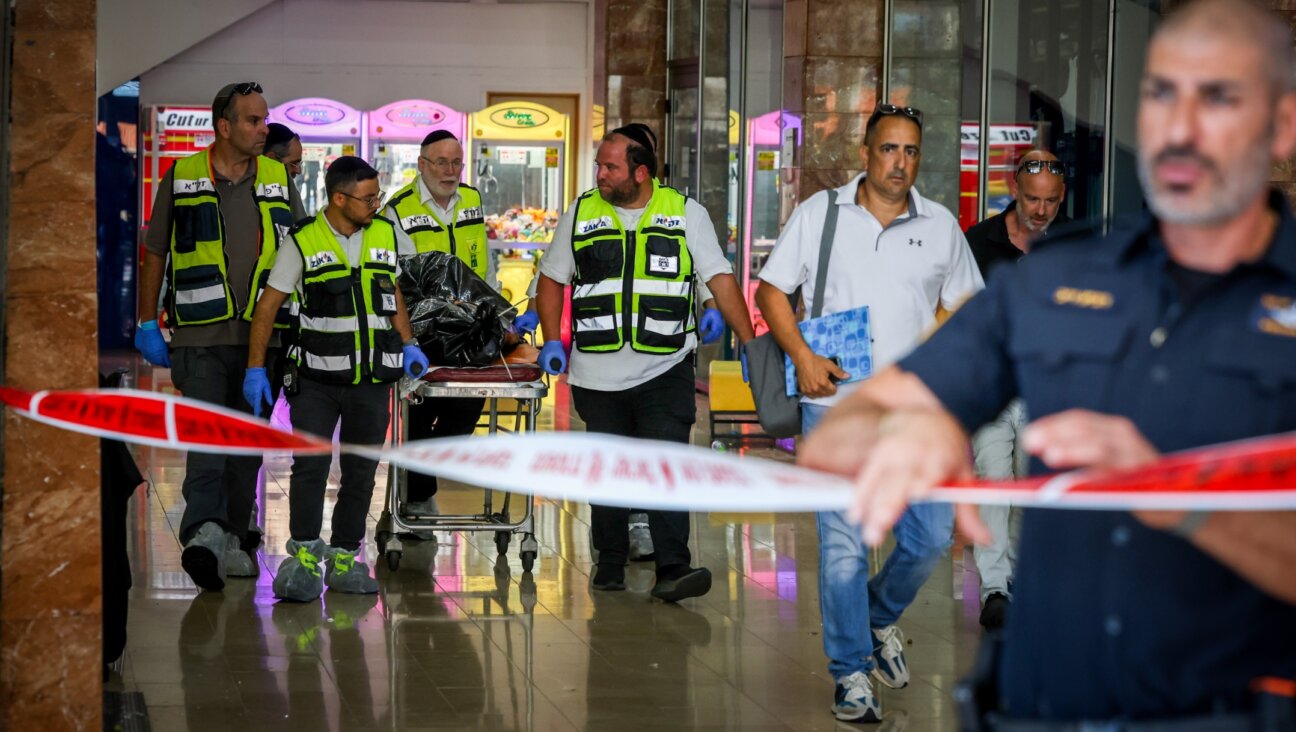 Police and rescue forces outside the scene of a stabbing attack in Karmiel, northern Israel, July 3, 2024. (David Cohen/Flash90)