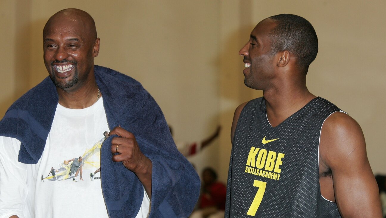 Joe Bryant, left and his son Kobe share a laugh at the Kobe Basketball Academy at Loyola Marymount University on July 5, 2007 in Los Angeles, California. (Noel Vasquez/Getty Images)