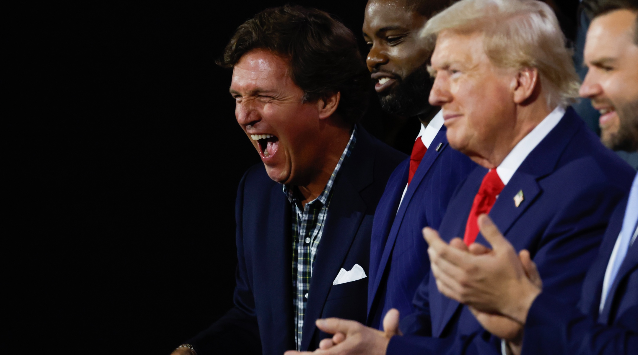 Tucker Carlson, U.S. Rep. Byron Donalds of Florida, former U.S. President Donald Trump, Sen. J.D. Vance of Ohio appear on the first day of the Republican National Convention at the Fiserv Forum, Milwaukee, July 15, 2024. (Chip Somodevilla/Getty Images)