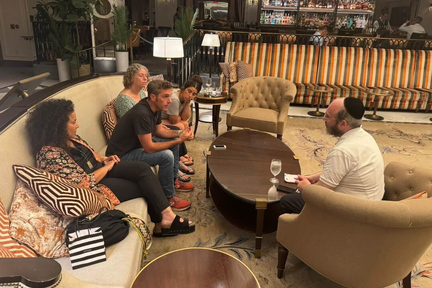 The Forward's senior political reporter, Jacob Kornbluh (right) interviews freed American hostage Aviva Siegel and her daughter Elan Siegel; Nina Venkart, mother of Israeli hostage Omer Venkart; and Udi Rosen, cousin of deceased hostage Tal Haimi; on July 21.