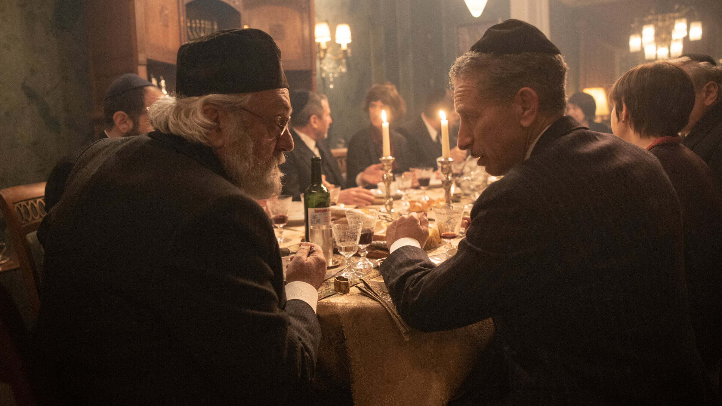 Avrum Goldstein (Mark Ivanir) and Jakob Grün (Moisej Bazijan) have Shabbat dinner in season four of <i>Babylon Berlin.</i>
