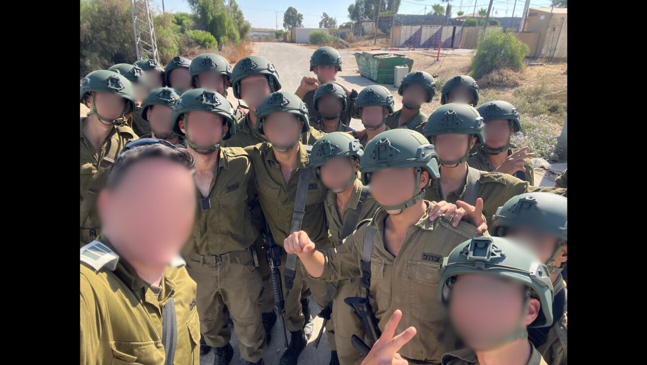Israeli soldiers wearing donated tactical helmets pose for a photo. The donations were made by a American civilian initiative known as Unit 11741. (Courtesy of Unit 11741)