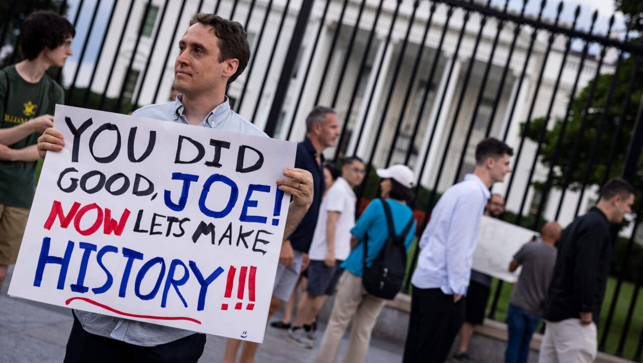A man holds a sign showing his appreciation for President Joe Biden in front of the White House after Biden announced he would drop out of the presidential election and endorsed Vice President Kamala Harris as a candidate for the Democratic Party's new nominee. 
