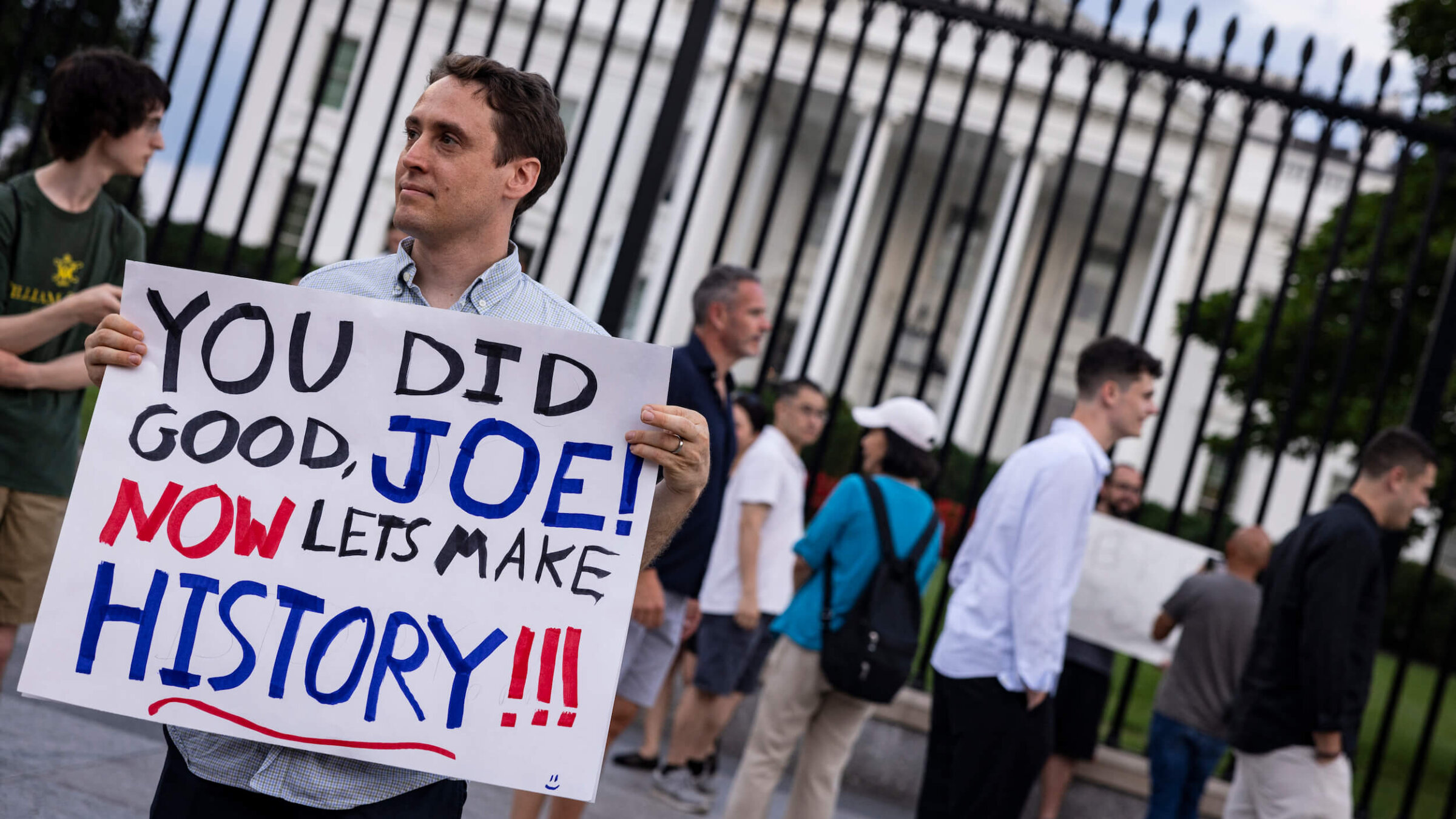A man holds a sign showing his appreciation for President Joe Biden in front of the White House after Biden announced he would drop out of the presidential election and endorsed Vice President Kamala Harris as a candidate for the Democratic Party's new nominee. 