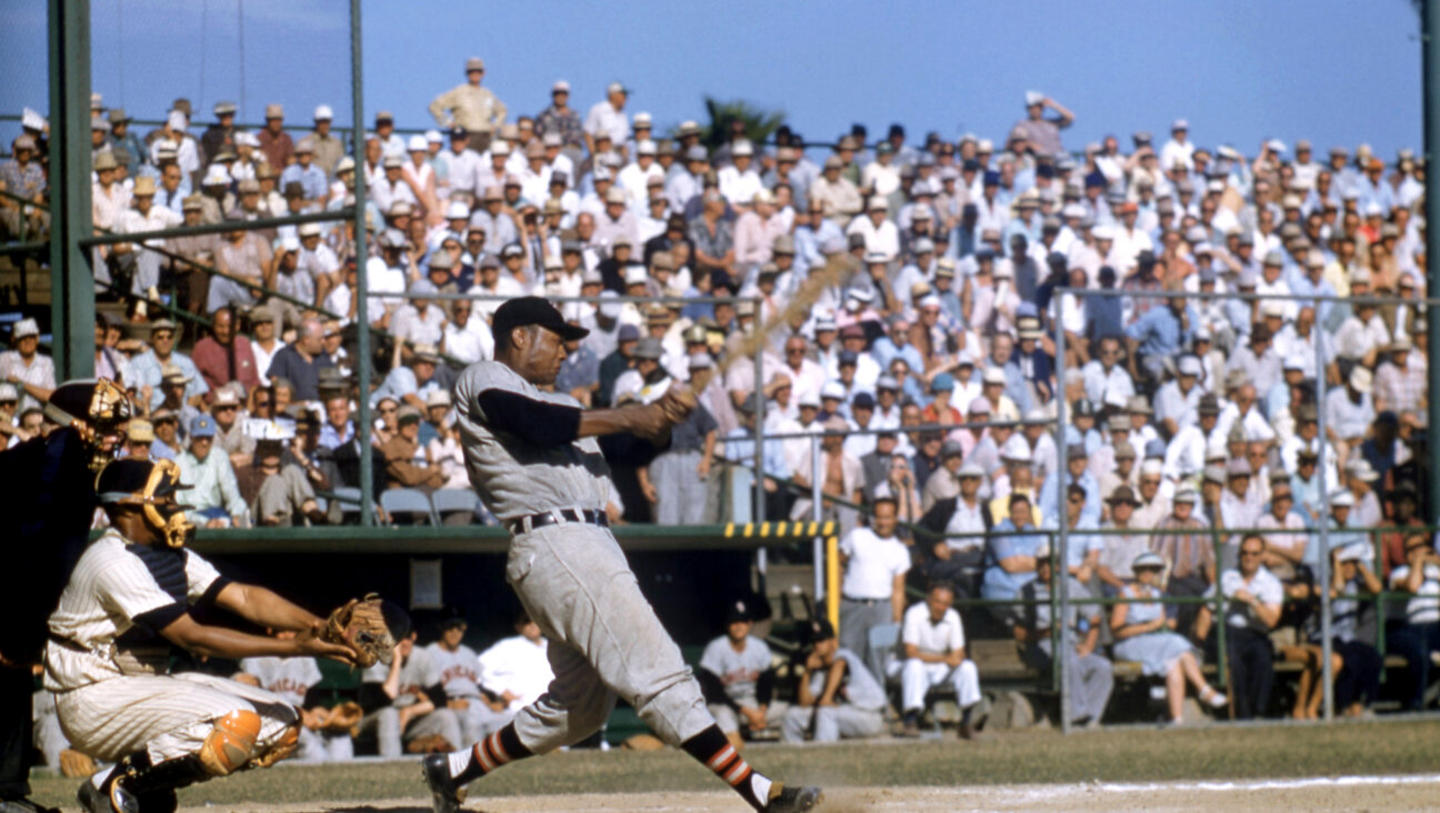  Larry Doby plays for the White Sox during a 1956 spring training game.