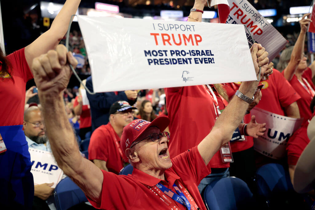 A delegate holds a pro-Israel "Trump" campaign sign during the Republican National Convention in Milwaukee on Tuesday.