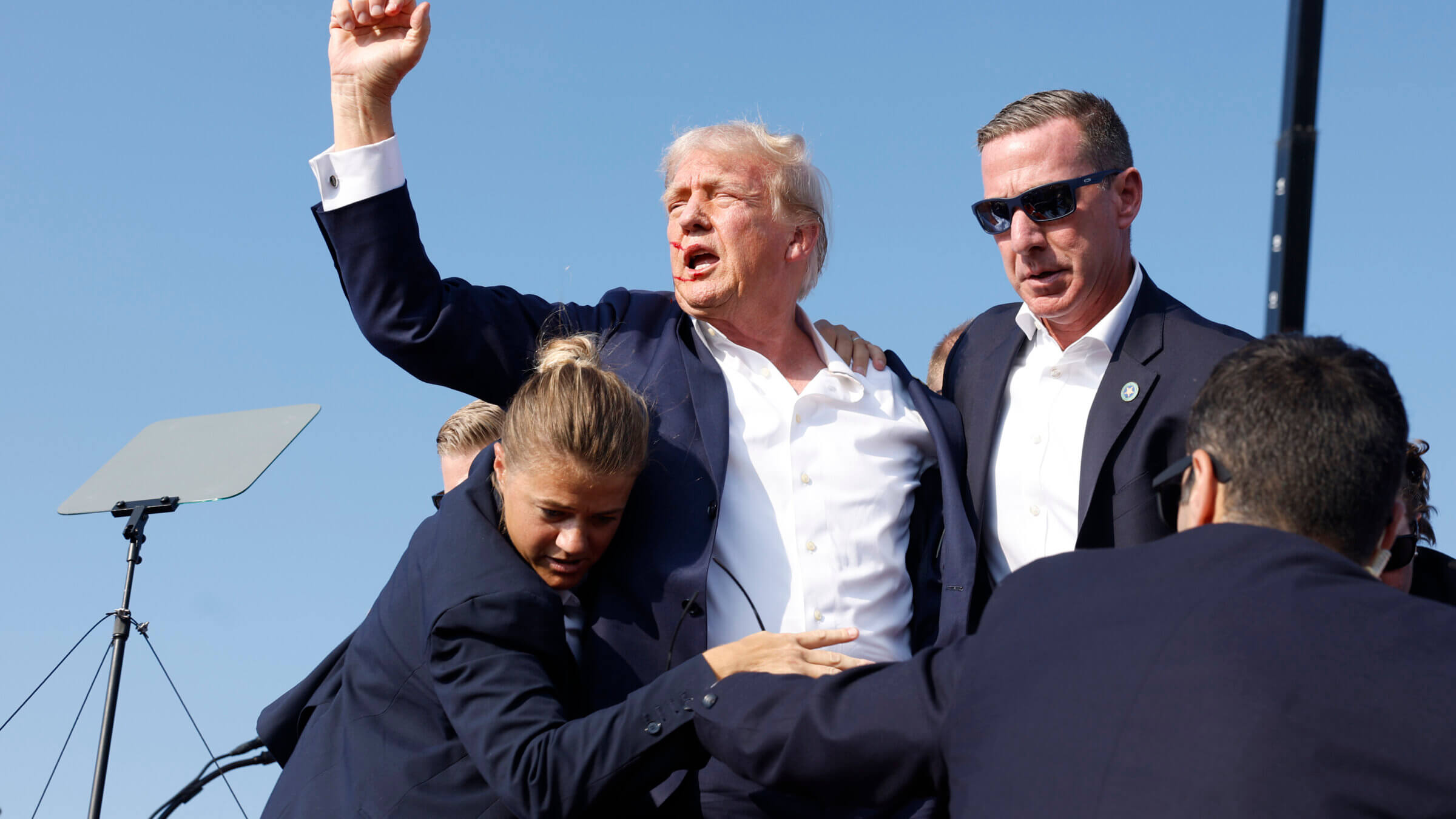 Republican presidential candidate and former President Donald Trump is rushed offstage by U.S. Secret Service agents after being grazed by a bullet during a rally July 13 in Butler, Pennsylvania.