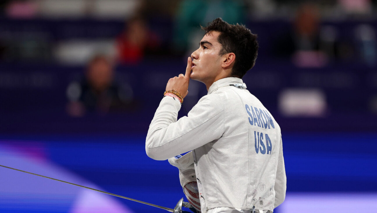 Mitchell Saron of Team United States, one of six Jewish fencers on the team, reacts during day one of the Olympic Games at the Grand Palais in Paris, July 27, 2024. (Patrick Smith/Getty Images)