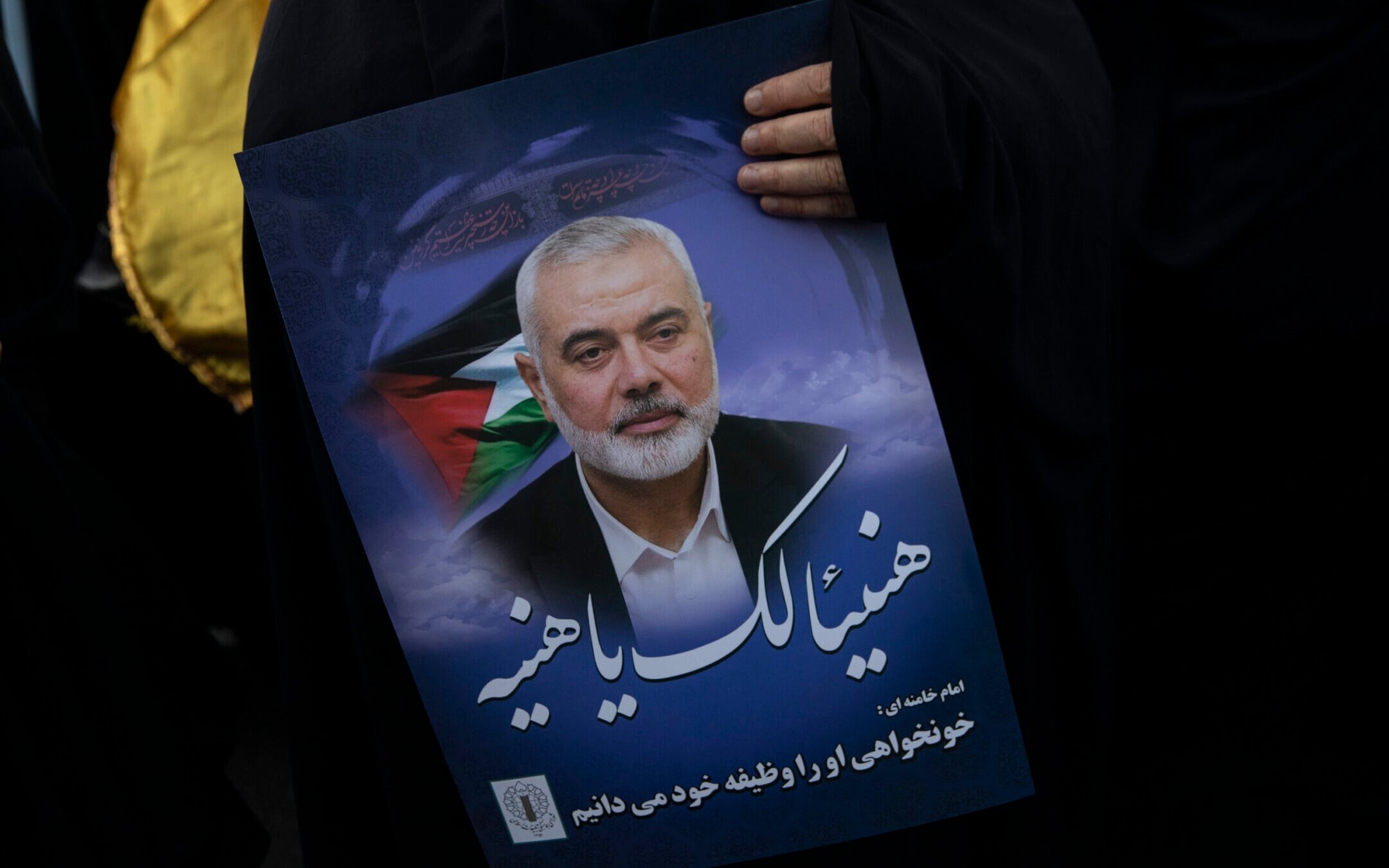 Iranians take part in a protest against the killing of Ismail Haniyeh, the political head of Hamas, in Palestine Square in Tehran, Wednesday, July 31, 2024. (Majid Saeedi/Getty Images)