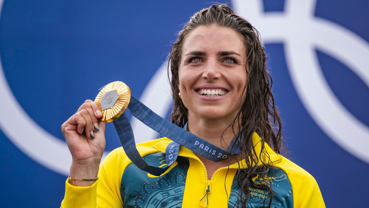 Jessica Fox on the podium during the canoe slalom medal ceremony after winning the women’s kayak single final, July 28, 2024, in Paris. (Kevin Voigt/GettyImages)