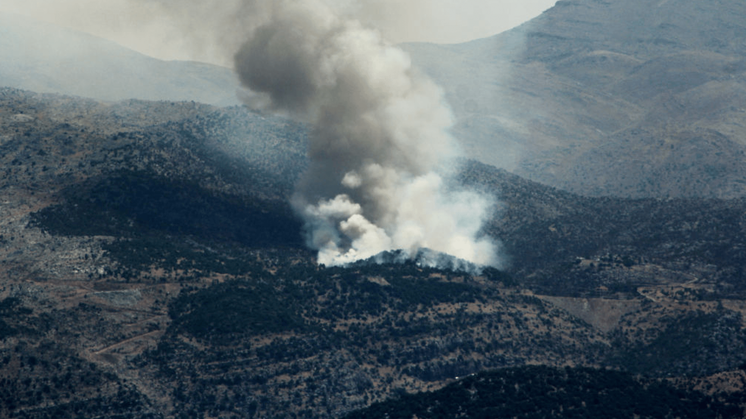 Smoke billows from forest fires near the southern Lebanese village of Shebaa on Thursday. The cross-border conflict with nearby Israel has escalated significantly since Israel killed a high-level Hezbollah commander on Wednesday.