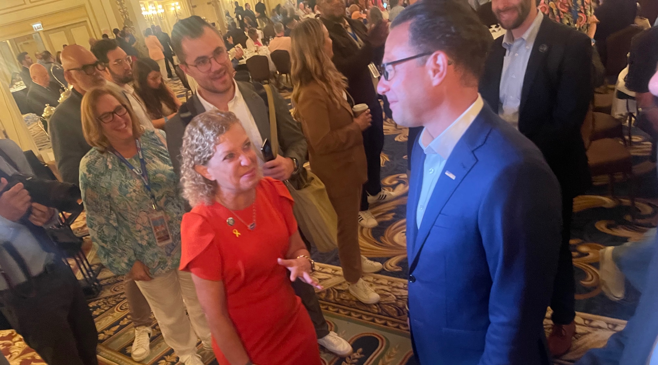 U.S. Rep. Debbie Wasserman Schultz, a Florida Democrat, chats with Pennsylvania Gov. Josh Shapiro at the Florida delegation breakfast at the Democratic National Convention, Chicago, Aug. 19, 2024. (Ron Kampeas)